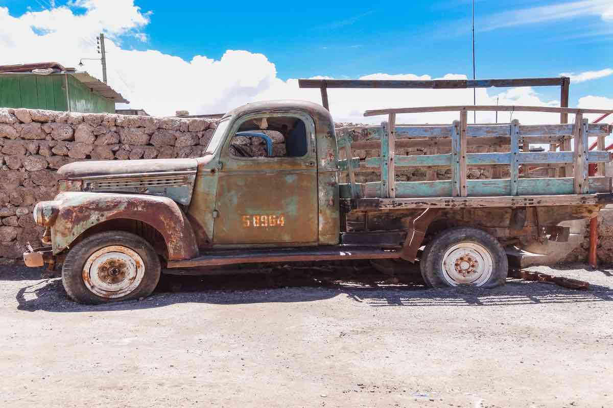 Colchani bolivia old rusty truck in colchani village at the edge of salar de uyuni